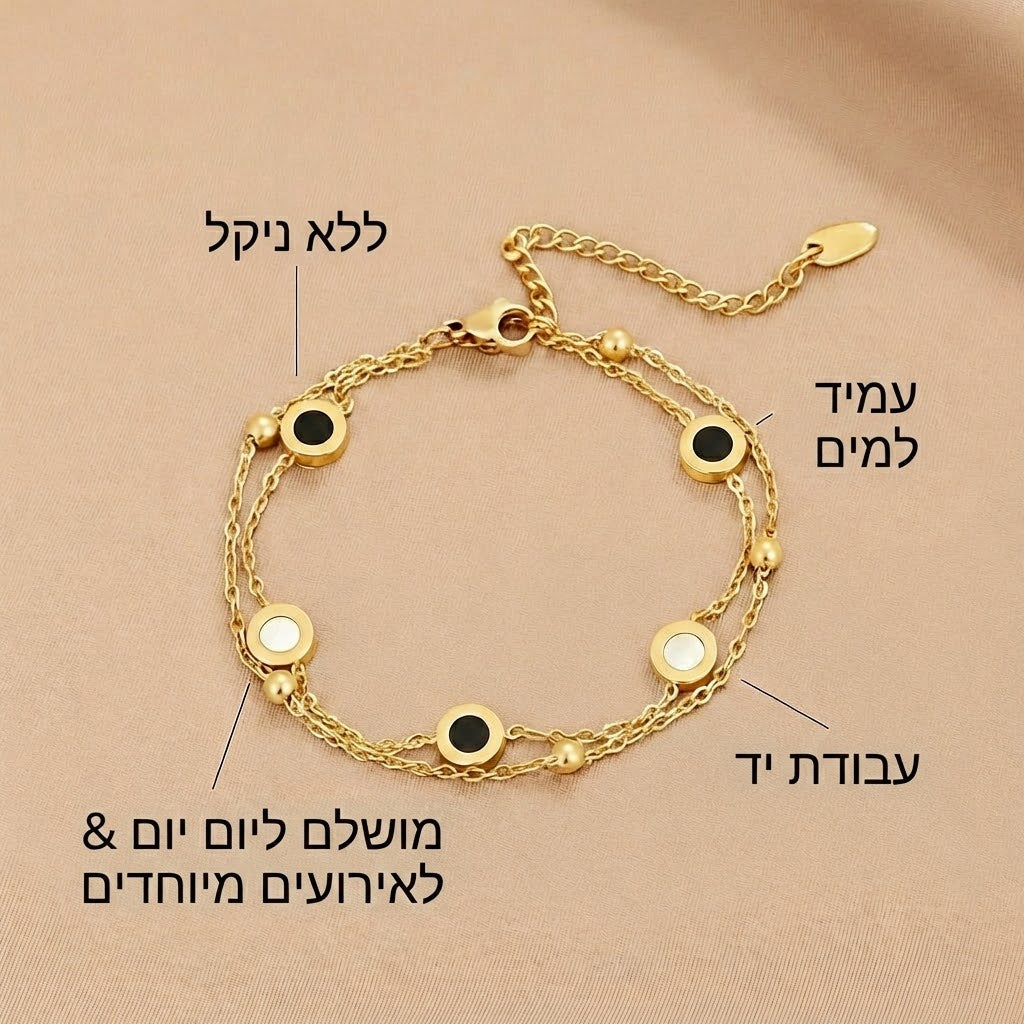 קרלה – צמיד זהב רך עם אלמנטים עגולים ממולאים בניגוד.
